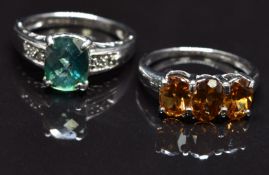 Two 9ct white gold rings, one set with citrine and the other topaz, size N, 7g