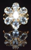 A 9ct gold ring set with quartz in a cluster, size N, 4.7g