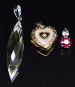 Two 9k white gold pendants, one set with a ruby the other citrine and diamond, together with a 9k
