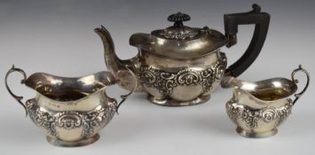 Edward VII hallmarked silver bachelor's three piece tea set with embossed decoration, Birmingham