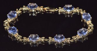 A 9ct gold bracelet set with set with oval cut amethysts, 15.4g