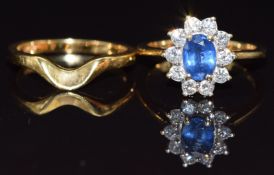 An 18ct gold ring set with an oval natural untreated sapphire of approximately 0.8ct, surrounded