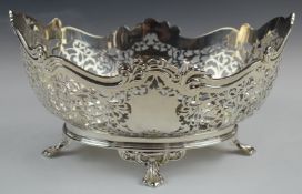 George V hallmarked silver oval bowl with pierced decoration, raised on four feet, Sheffield 1928,