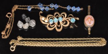 A 9ct gold brooch set with zircons and pearls, section of 9ct gold necklace (7.6g), loose rough