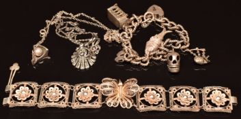 A silver charm bracelet, white metal filigree bracelet, silver and marcasite necklace and a silver