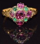 A 12ct gold ring set with garnets and paste, Birmingham 1869, size K, 1.2g