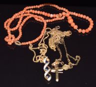 A 9ct gold pendant set with sapphires and diamonds, 9ct gold cross pendant, three 9ct gold chains (