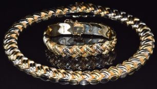 An 18ct gold bi-coloured necklace and matching bracelet by Quadri, 156.4g