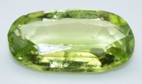 A loose 2.19ct oval mixed cut peridot with certificate