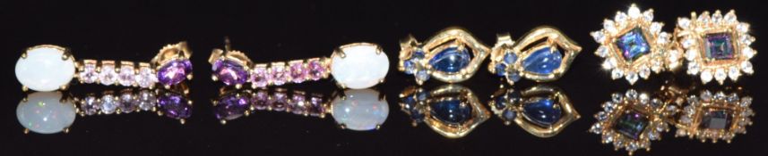 Three pairs of 9ct gold earrings, one set with sapphires, one mystic topaz and the other amethyst