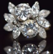 An 18ct white gold ring set with two round cut diamonds of approximately 0.6ct and further