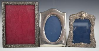 Three hallmarked silver photograph frames, the largest to suit 8 x 6 inch photo, Birmingham 1906,