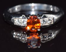 A 9k gold ring set with clinohumite and topaz, size N, 3.3g