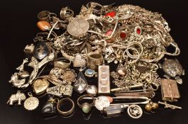 A large collection of silver jewellery including ingot, charms, paste set brooch, brooches,