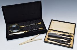 Cased magnifying glass and letter opener, cased ebony shoehorn, glove stretcher and button pull etc