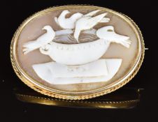 Victorian brooch set with a cameo depicting doves in a bird bath