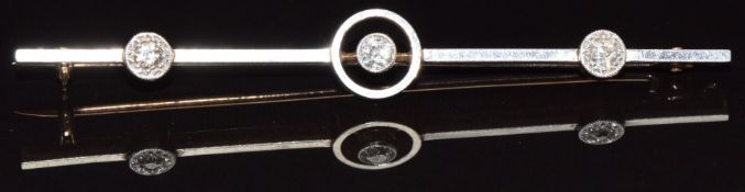 A c1915 18ct gold brooch set with three diamonds with platinum finish, 4.1g