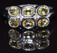 A 9k white gold ring set with yellow beryl and pink tourmaline, size N, 3.6g