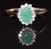 A 9ct gold ring set with an oval emerald and diamonds, size O, 1.7g