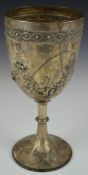 Victorian hallmarked silver trophy cup or goblet with embossed floral decoration and gilt wash
