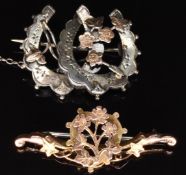 Edwardian 9ct gold brooch (1.8g) and a Victorian silver brooch in the form of two horseshoes with