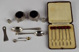 Pair of Indian, Burmese or similar white metal salts with blue glass liners, cased set of six