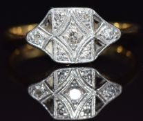 An 18ct gold ring set with diamonds in a platinum setting, size K, 2.1g