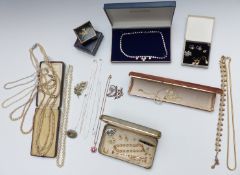 A collection of costume jewellery including faux pearls, diamanté necklace, silver brooch,