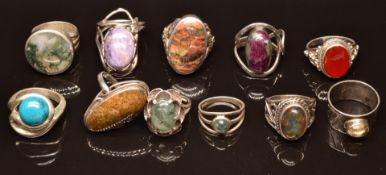 Four silver rings set with moss agate and seven rings set with various hardstones/ quartz