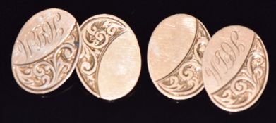 A pair of 9ct gold cufflinks by Georg Jensen with engraved scrolling decoration, Birmingham 1904,