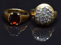 Two 9ct gold rings, one set with tourmaline the other garnet, size N, 7.2g