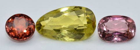 A pear cut green tourmaline, a round cut red tourmaline and a cushion cut pink tourmaline, 1g