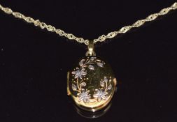 A 9ct gold chain/ necklace and a 9ct gold locket with floral decoration, 4.3g