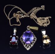 Three 9k gold pendants set with garnet and white topaz, tourmaline and amethyst and a 9ct gold