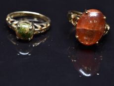 Two 9ct gold rings, one set with a sunstone cabochon the other a unakite cabochon, size N, 9.9g