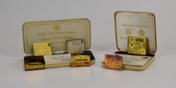 Three silver gilt commemorative railway themed stamps, together with a cased Universal Postal