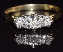 A 9ct gold ring set with three diamonds in star settings, size O, 1.9g
