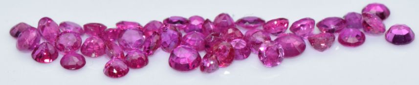 Forty three loose round cut natural unheated Burmese rubies, total carat weight approximately 5.