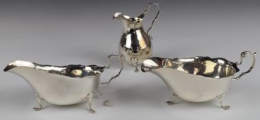 Edward VII pair of hallmarked silver sauce boats with scrolling handles, length 16cm, Birmingham