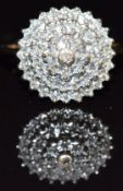 A 9ct gold ring set with diamonds in a cluster, size I, 2.6g
