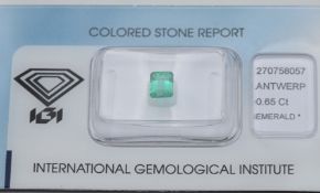 A loose 0.65ct emerald cut natural Colombian emerald with certificate