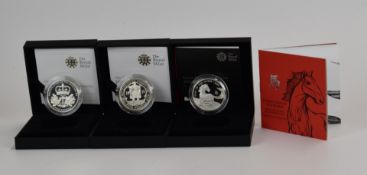 Three Royal Mint coins comprising 2009 Henry VIII and 2010 Restoration of the Monarchy £5 silver