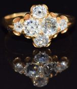 A c1870 18ct gold ring set with six old cut diamonds measuring approximately 0.51, 0.47, 0.22, 0.19,