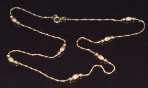 A 9ct gold necklace with sphere and oval links, 3.2g