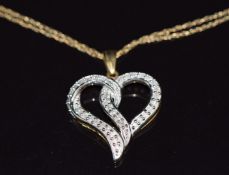 A 9ct gold heart pendant set with diamonds on 9ct gold chain, 2.9g, length 2.5cm