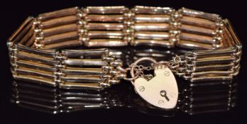 A 9ct rose gold gate bracelet with 9ct gold heart padlock/ clasp, 24g