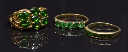 Three 9ct gold rings set with diopside, size N, 8g