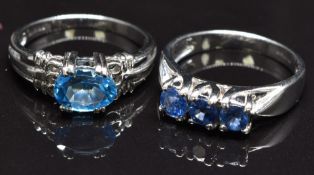 Two 9ct white gold rings, one set with topaz and the other sapphires, size N, 6.5g