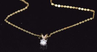 A 9ct gold pendant set with a diamond of approximately 0.25ct on a 9ct gold chain, 0.9g
