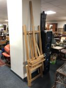 A large folding artist's easel with set square.